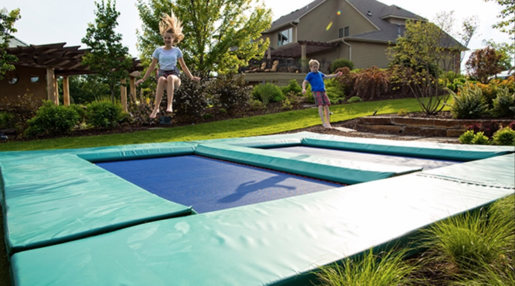 What is the safest trampoline? MaxAir's 7x14 side by side trampolines provide extra thick pads around all sides. Kids bouncing next to each other in the backyard.