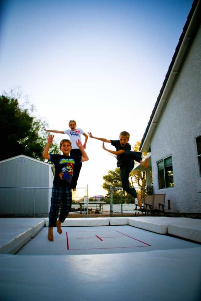 Kids enjoying a Max Air family trampoline.