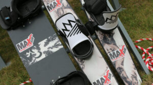 A closeup of a tramp board and tramp skis from Ski Addiction branded with MaxAir Trampolines.