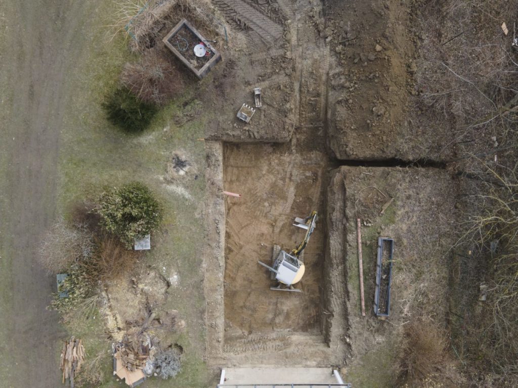 Can you put a normal trampoline in the ground? Yes, but it should be done by a professional contractor (as shown).