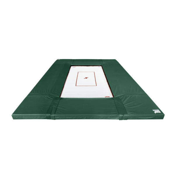 Medium green deluxe safety pads surround an in-ground white fly bed with MaxAir Trampolines markings.