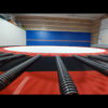 The Nova trampoline bed outstretched and strung up by springs.