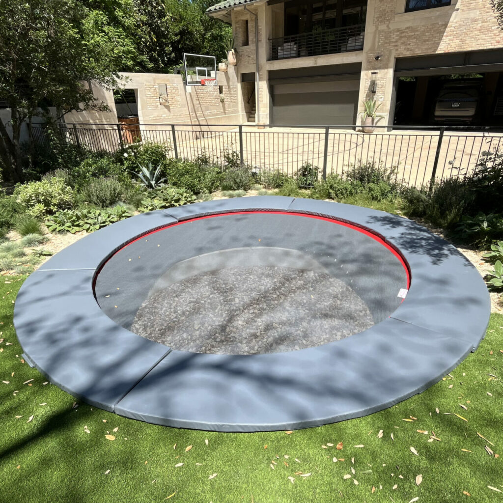 A circular inground trampoline.
