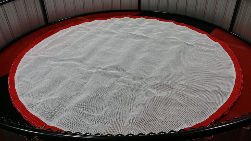 An unfolded, uninstalled Nova trampoline bed.